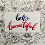 florals and lettering "hello Beautiful" in white